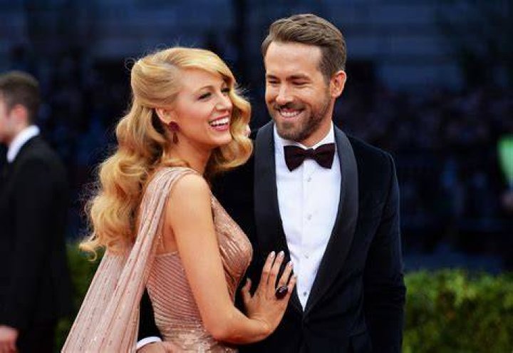 Ryan Reynolds and Blake Lively pose for photos with their newborn at